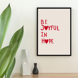 affiche citation motivante "be joyful in hope" rouge et beige